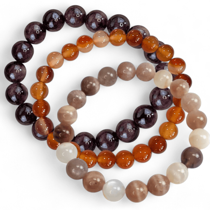 Sacral chakra crystal bracelet stack with sunstone carnelian and garnet. Available at Zen Collection Metaphysical Store in Barrie