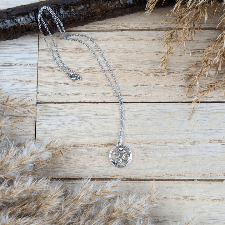 Close-up of the Sacred Om Necklace with a silver Om symbol enclosed in a circle