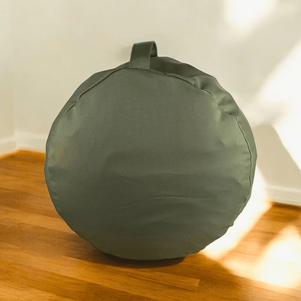 Portable sage green cushion for yoga and meditation.