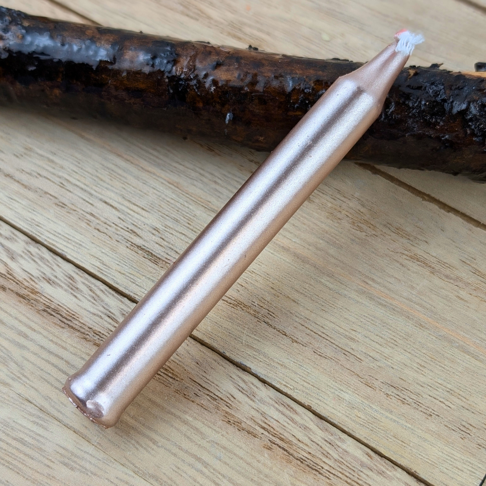 Metallic rose gold candles for meditation and self-care