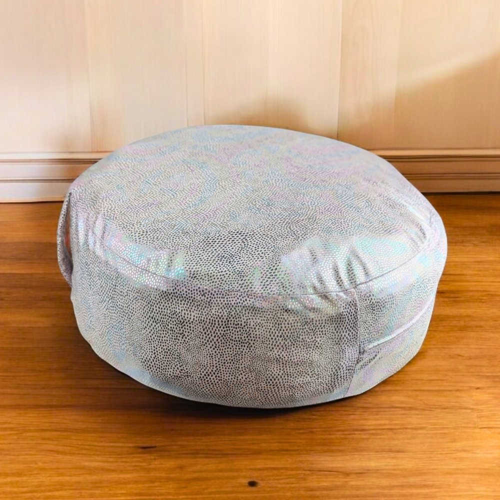 Soft and supportive meditation cushion on wooden floor