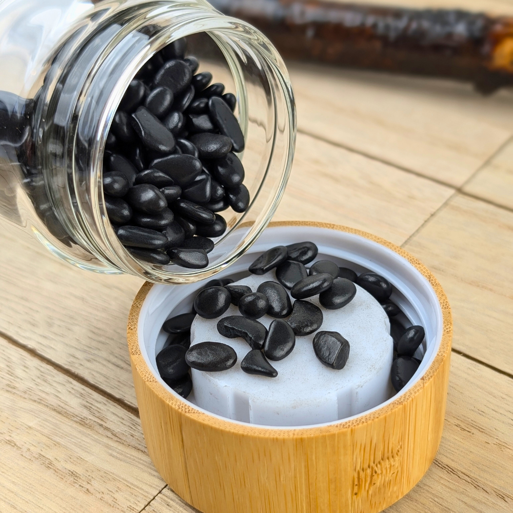 Close-up of Shungite crystals in the water bottle base.