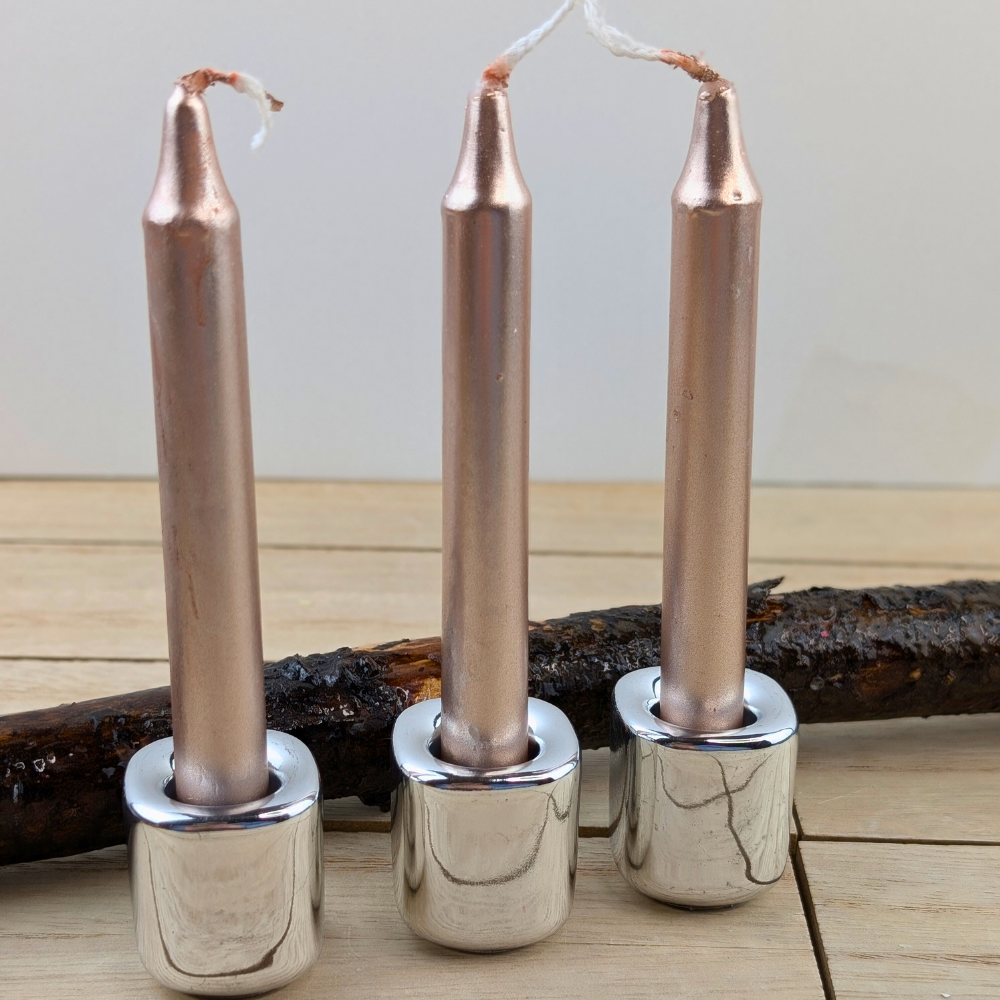 Compact rose gold candles for altars and affirmations