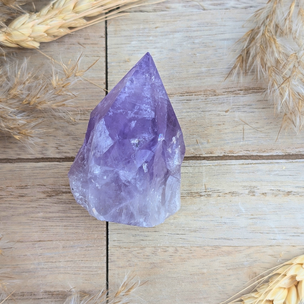 Polished Small Amethyst Point crystal, side view.