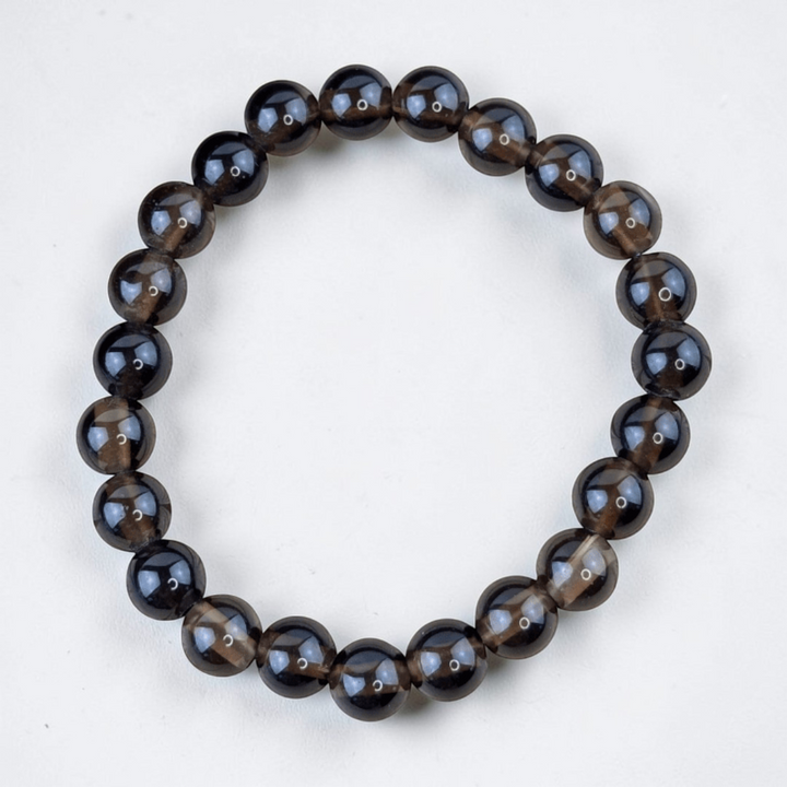 Smoky quartz bracelet for root chakra support. Available at Zen Collection Metaphysical Store. Shop no in-store or online