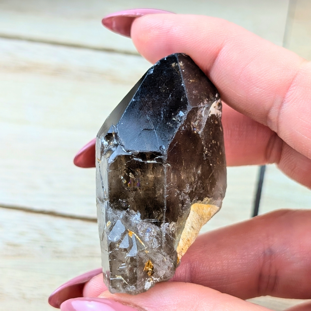 Compact Smoky Quartz point for intention-setting and meditation