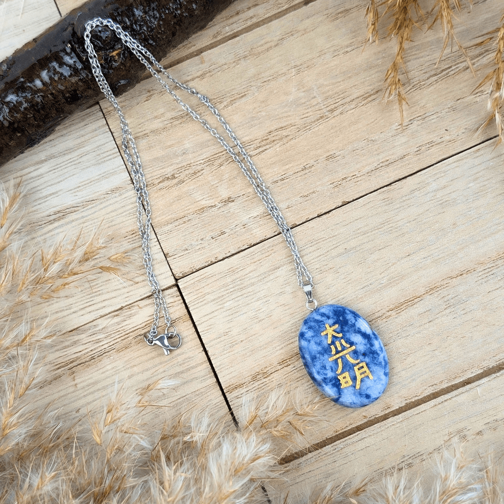 Sodalite pendant necklace displayed on a rustic wooden background