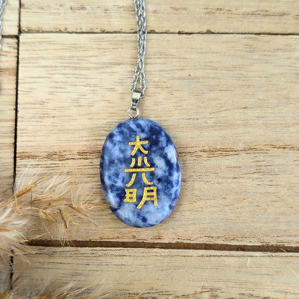 Silver-tone chain necklace featuring a Reiki-engraved Sodalite stone