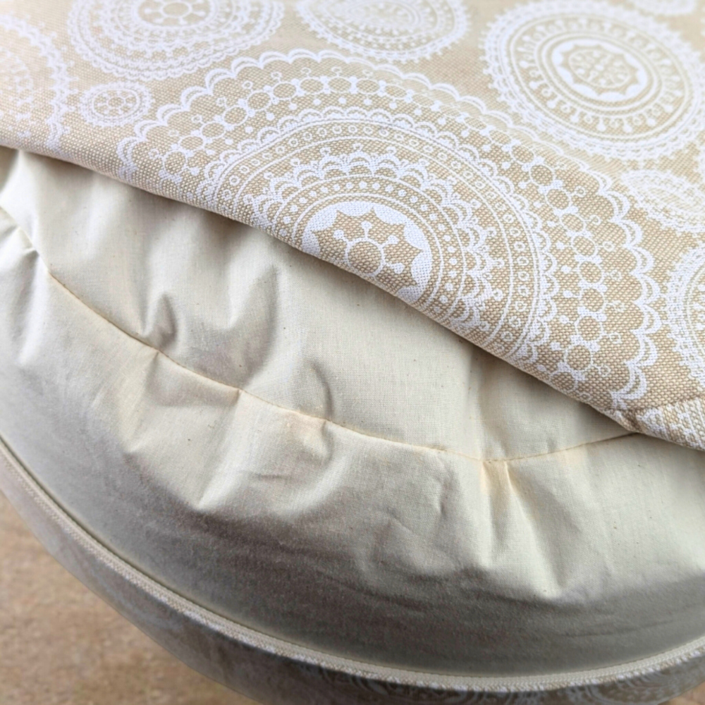 Close-up of a white mandala meditation cushion