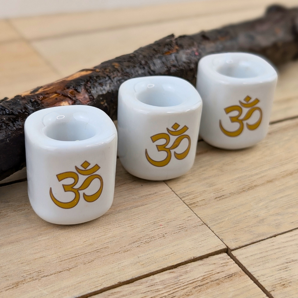 Ceramic chime candle holder with spiritual Om design