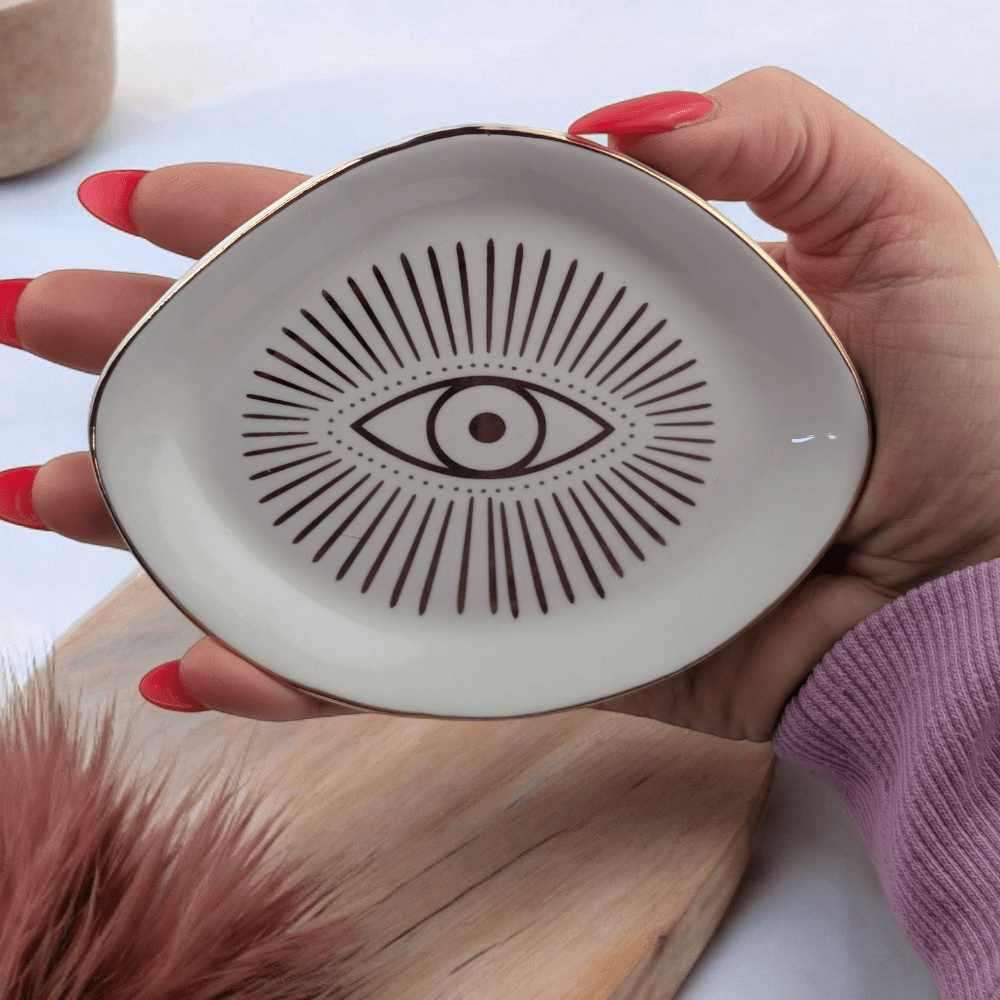 White and gold evil eye dish from Zen Collection