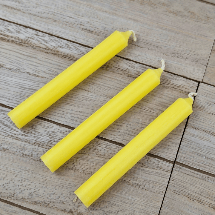 Bright yellow mini ritual candle for manifestation
