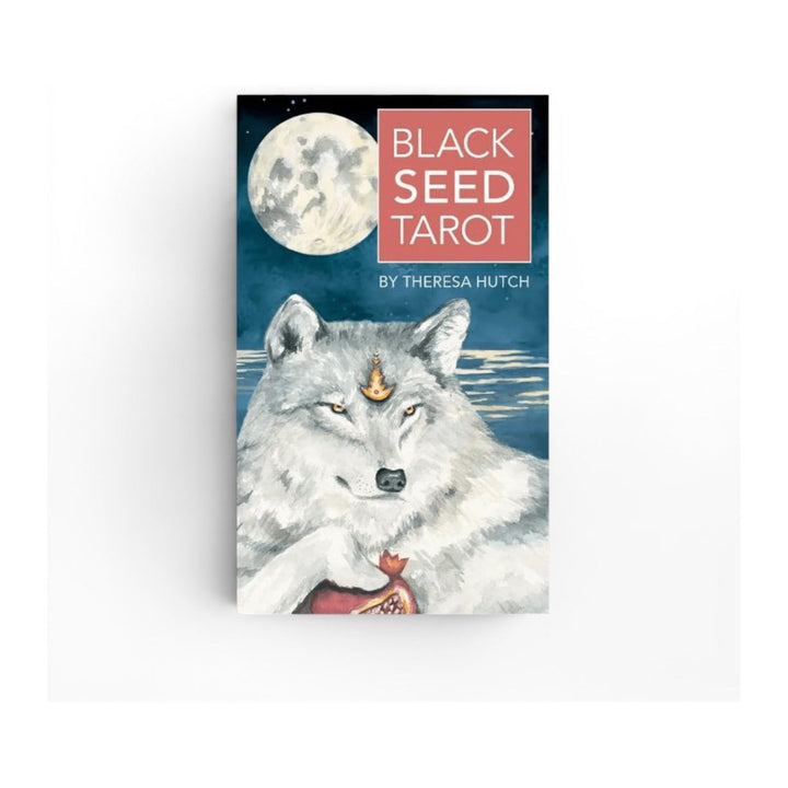 Black Seed Tarot box front by Theresa Hutch, showing a white wolf under a full moon