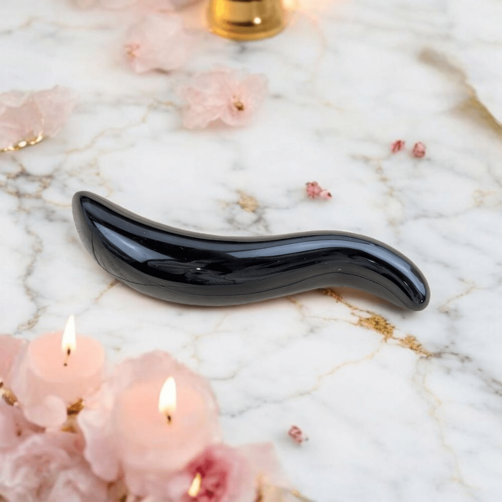 Root chakra massage tool in obsidian