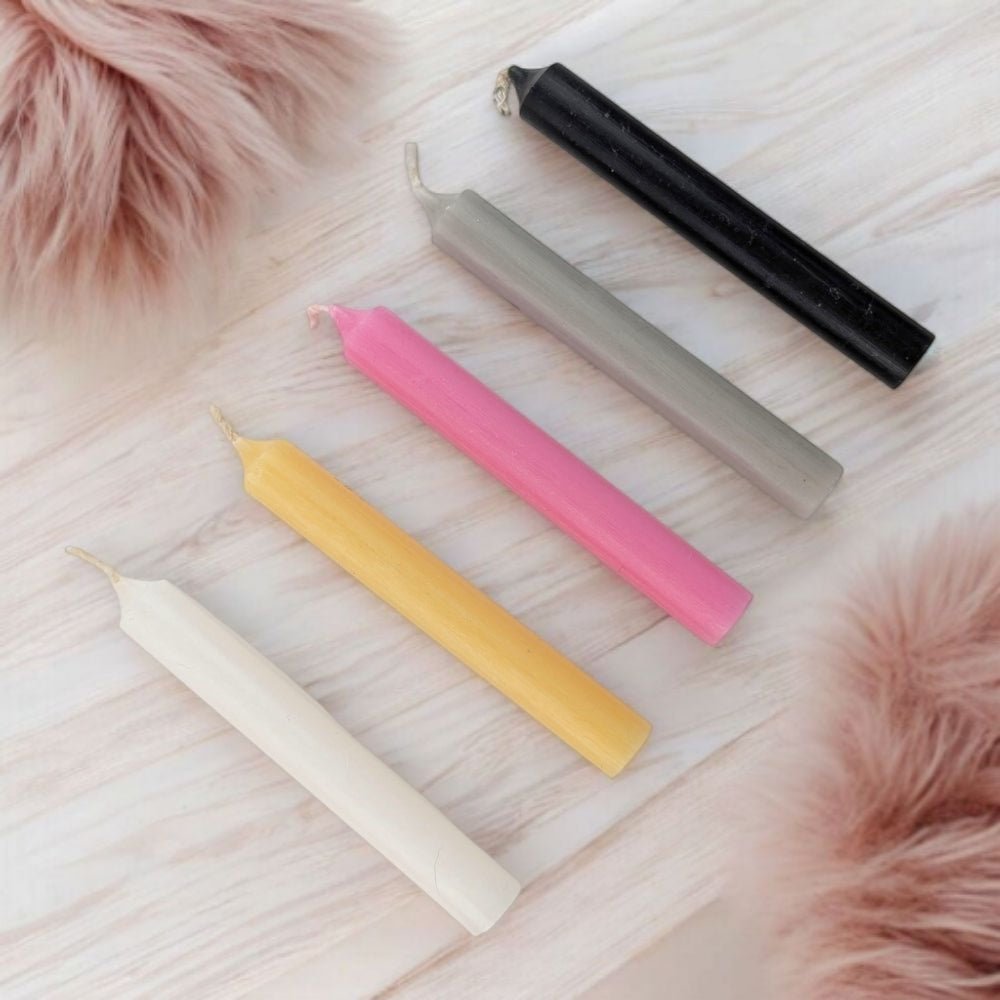 breakup and moving on candle set with five chime candles on a wooden surface with pink fur accents