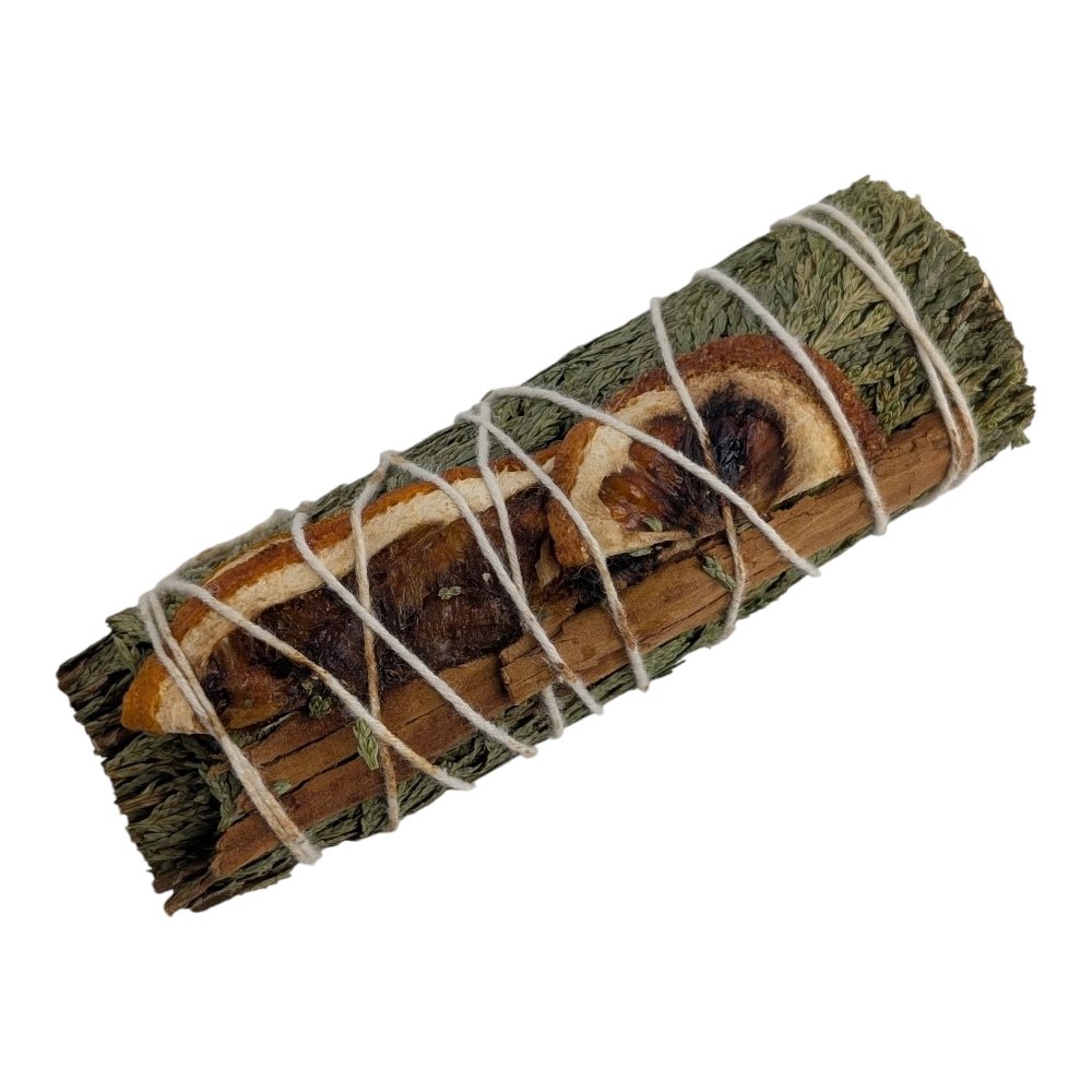 Bundled cedar sticks tied with twine on a white background sourced by zen collection crystal stores