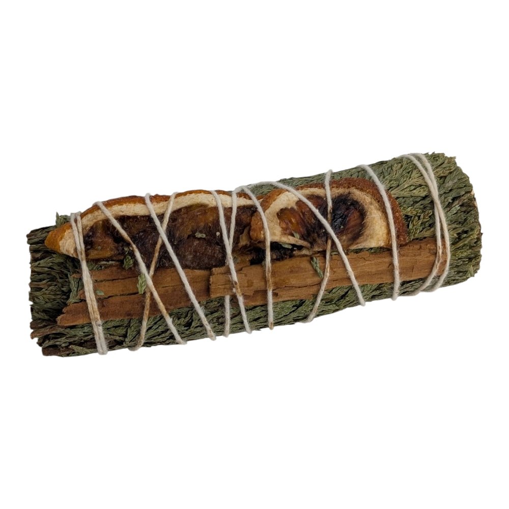 Bundled cedar and cinnamon sticks tied with twine on a white background sourced from zen  collection crystal store in Barrie Ontario