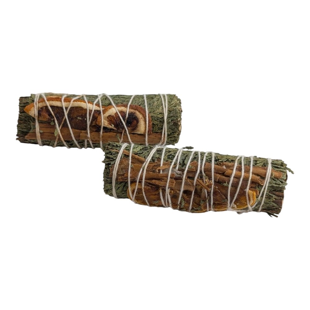 Two bundles of cedar and cinnamon sticks tied together on a white background available at zen collection crystal stores in barrie