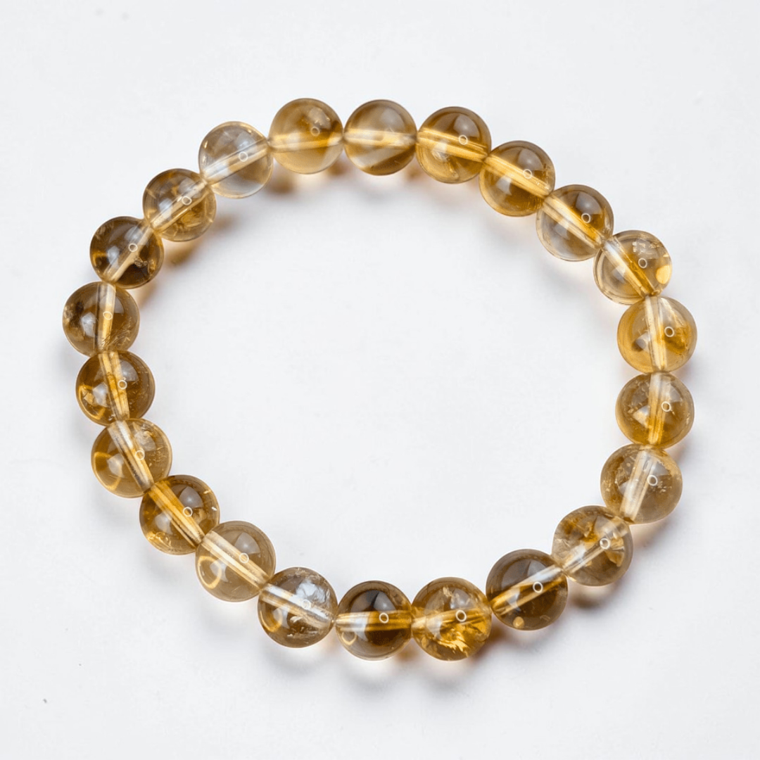 Stone of abundance citrine jewelry for positivity. Citrine bracelet with 7mm golden beads available at Zen Collection Crystal Store in Barrie. Shop in-store or online now