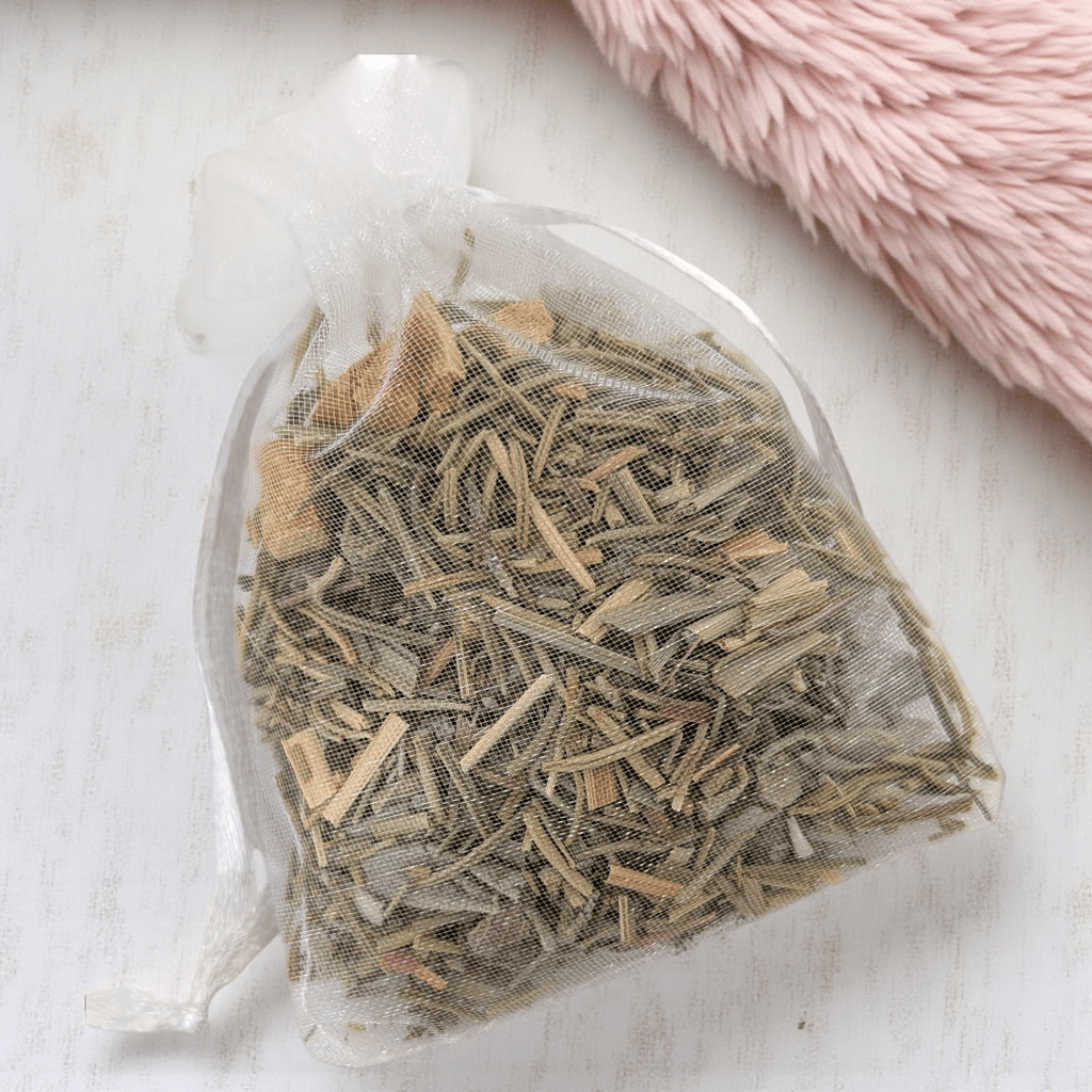 Two transparent bags filled with dried witch herbs on a light wooden surface. Available at Zen Collection Metaphysical Stores Barrie