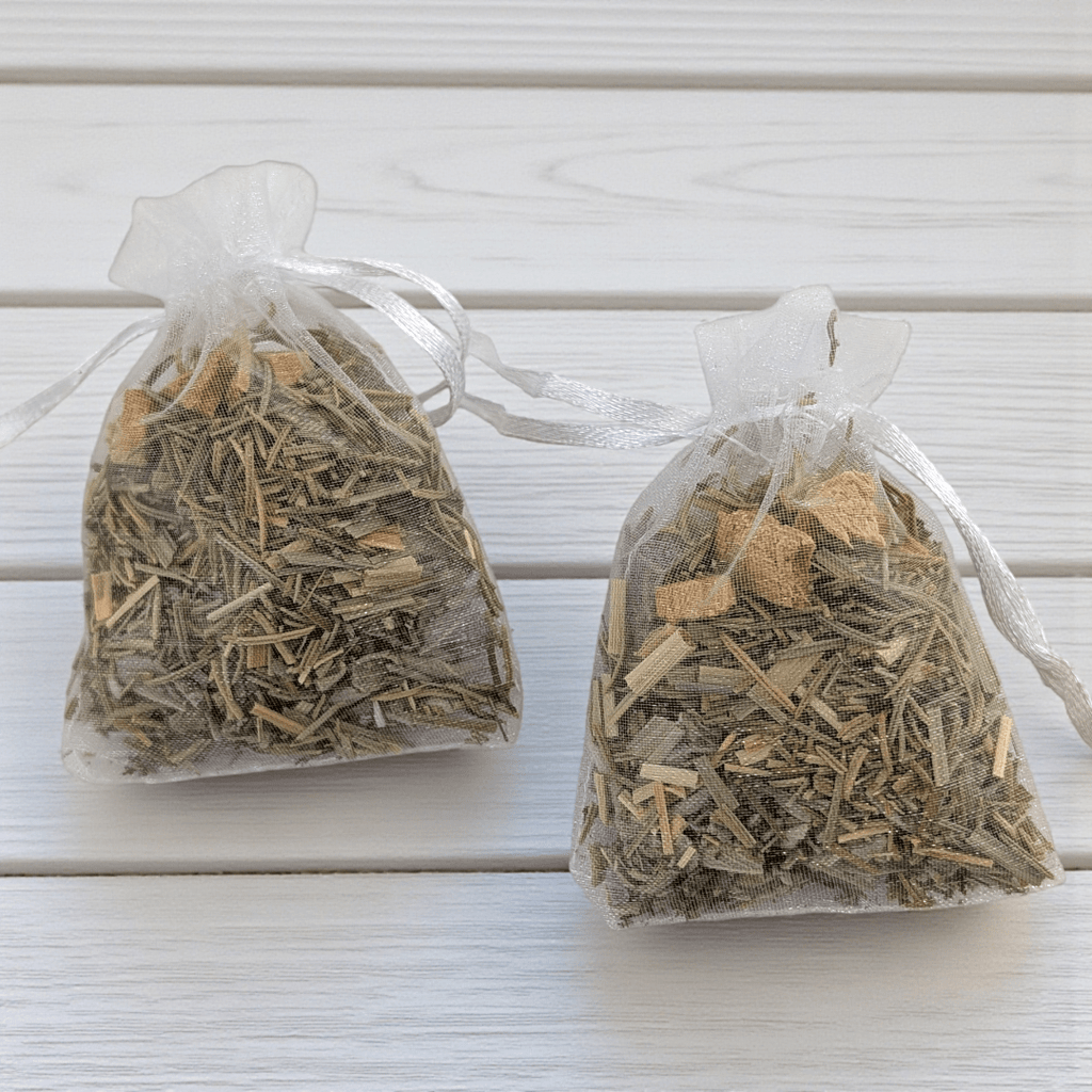 Two transparent bags filled with dried witch herbs on a light wooden surface. Available at Zen Collection Metaphysical Stores Barrie