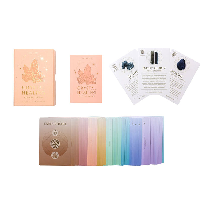 Box, guidebook and cards from the Crystal Healing Card Deck, including Smoky Quartz and Earth Chakra