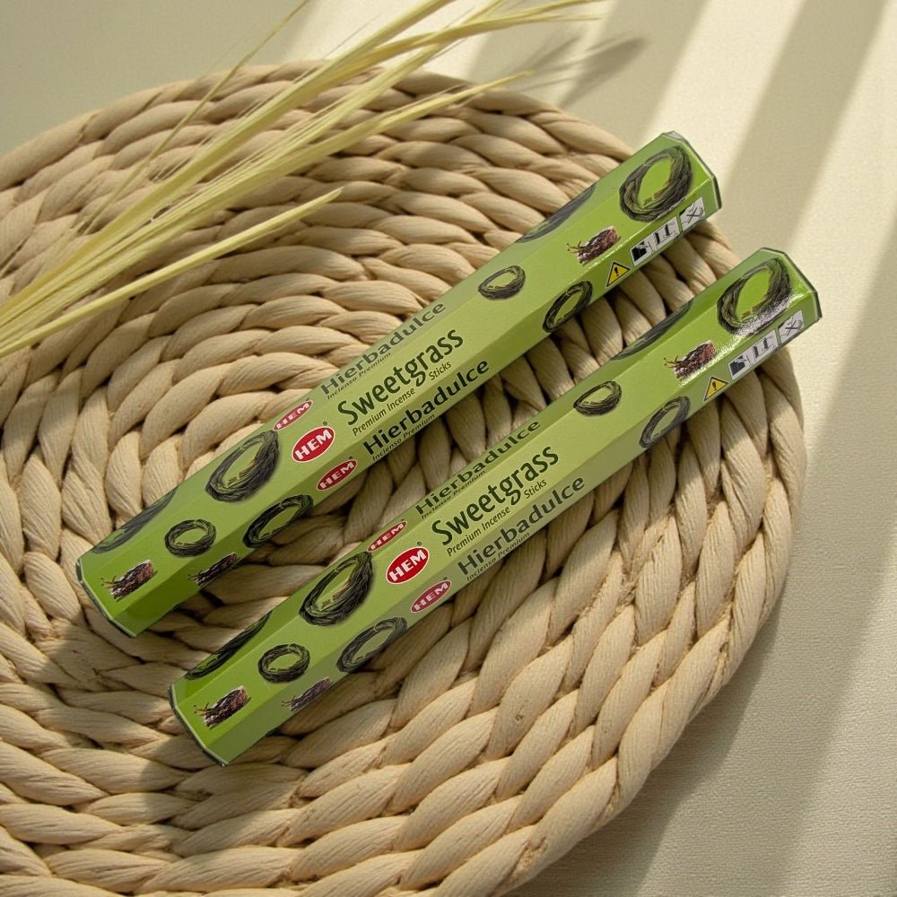 Two packages of Sweetgrass incense on a woven mat with grasses available at zen collection metaphysical stores barrie