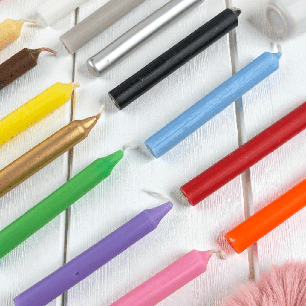 Colorful candles on a white background. Deluxe spell candle kit available at zen collection crystal store in Barrie.