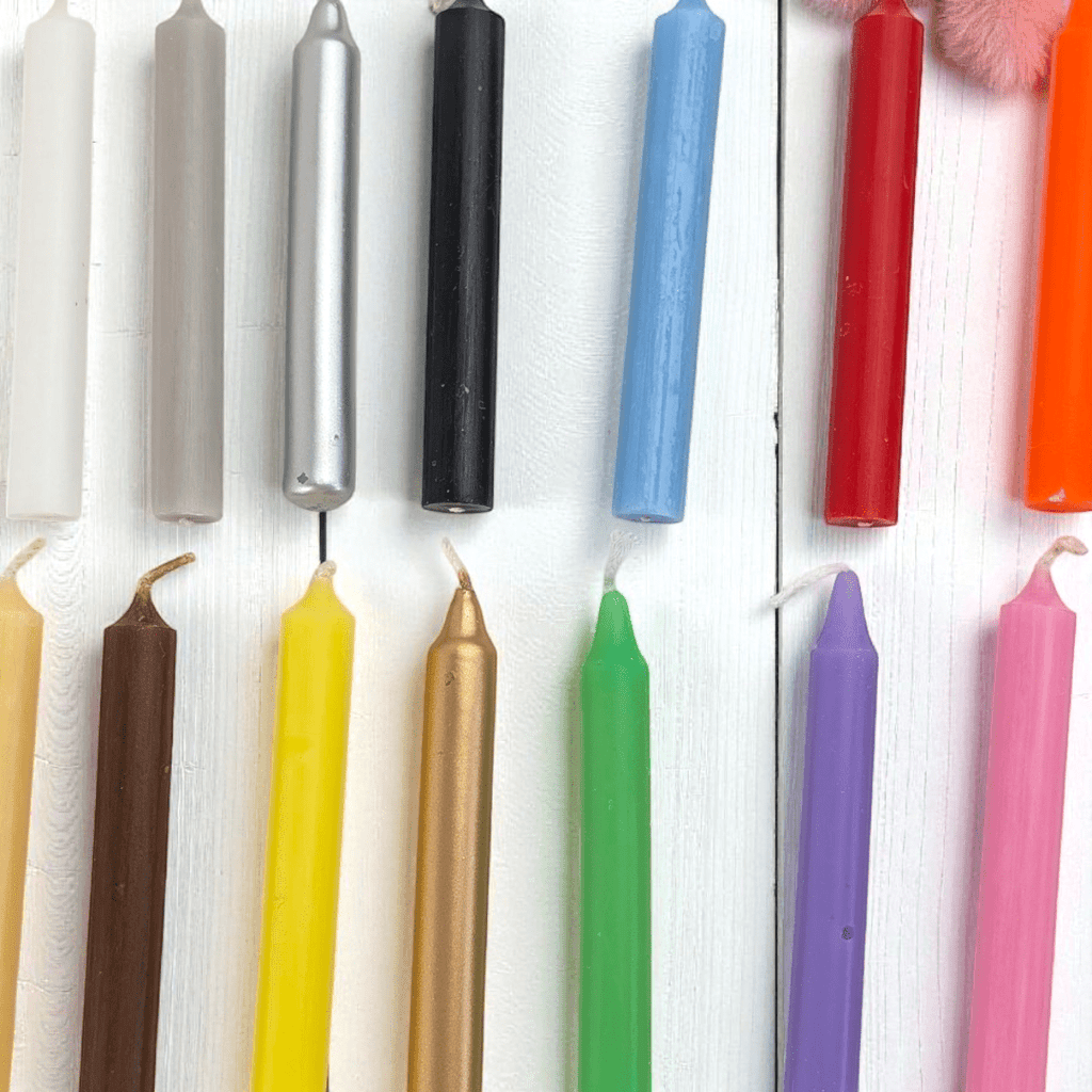 Assorted colorful candles on a white background. Deluxe spell candle kit available at zen collection crystal store in Barrie. Shop in-store or online.