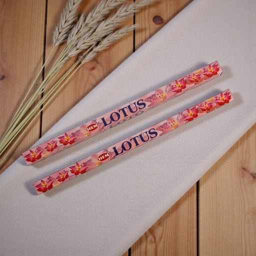 Two packs of Lotus incense on a white surface with a wooden background available at Zen Collection Metaphysical store near me