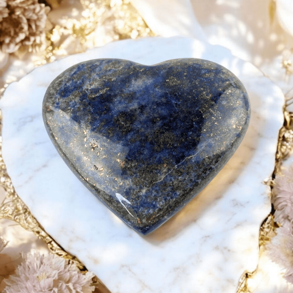 Lapis Lazuli crystal heart on neutral background