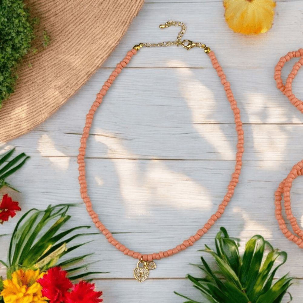 adjustable peach bead necklace with charm