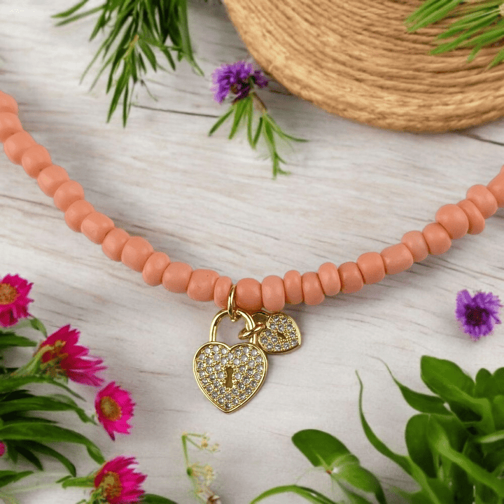 gold heart charm beaded necklace
