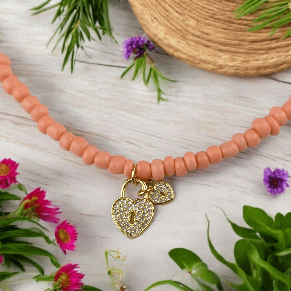 gold heart charm beaded necklace
