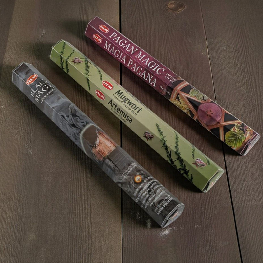 Three packages of incense sticks with labels on a wooden surface available at zen collection metaphysical store in barrie