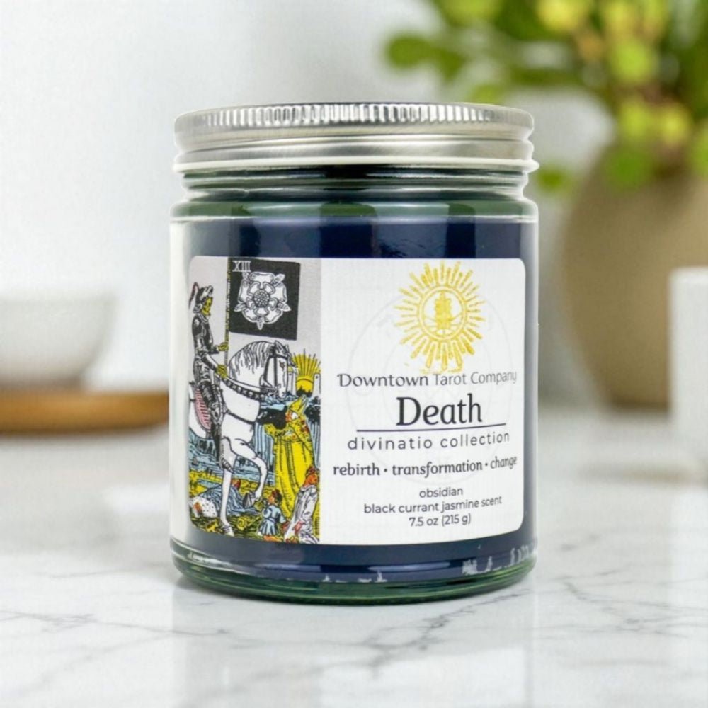 Tarot Candle jar with black obsidian crystal on a marble surface. Available at  Zen Collection Barrie crystal store