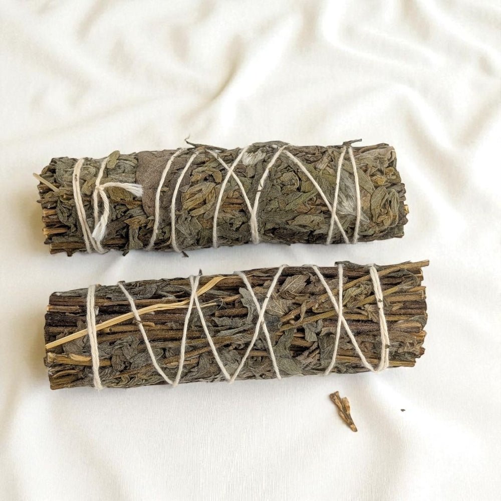 Two bundles of mugwort tied with twine on a white background available at barrie crystal store