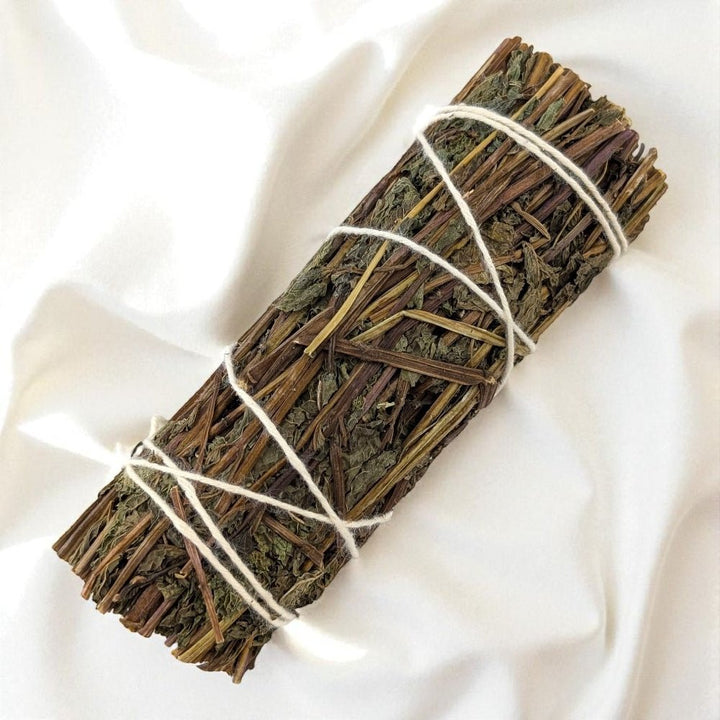 Bundled peppermint stick on a white fabric background available only at zen collection metaphysical store in Barrie
