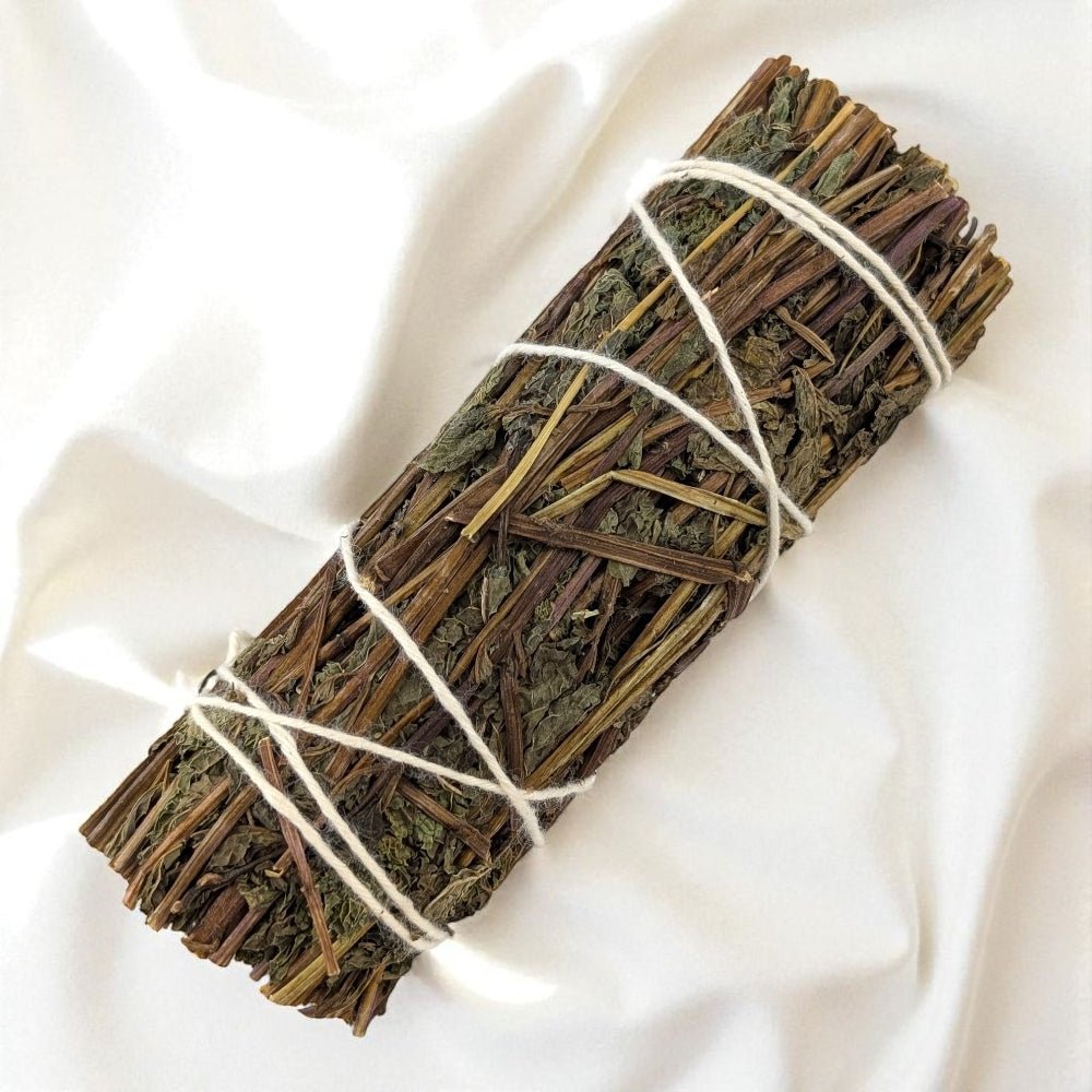 Bundled peppermint stick on a white fabric background available only at zen collection metaphysical store in Barrie
