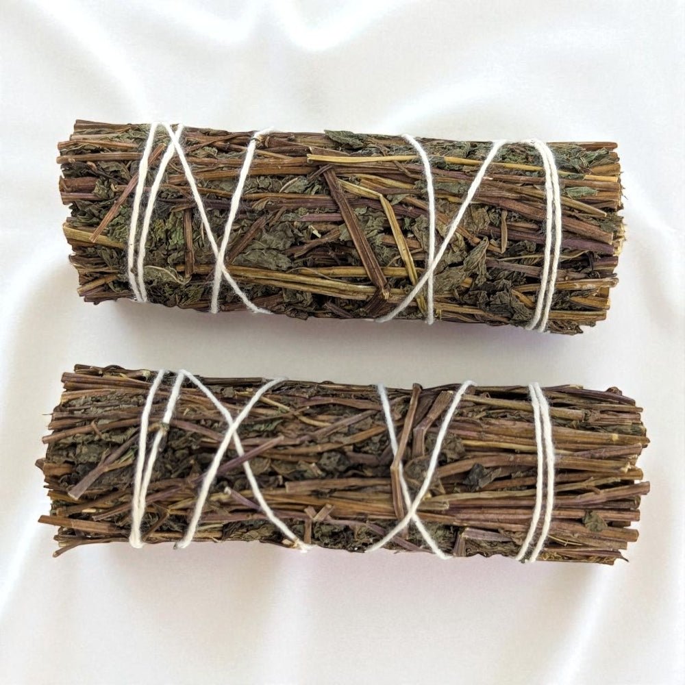 Two bundles of dried pure peppermint bundles tied with twine on a white background available to zen collection crystal store in Barrie