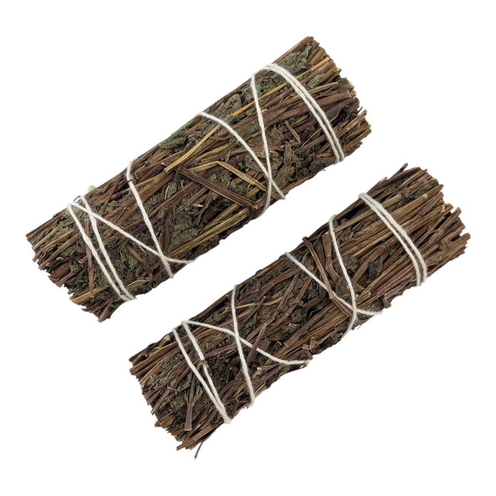 Two bundles of dried peppermint tied with string on a white background sourced by crystal store in barrie ontario canada