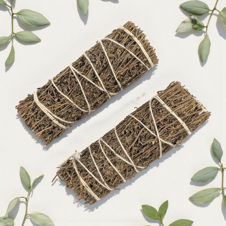 Two Pure thyme bundles tied with twine on a light background with green leaves. available in Barrie crystal store