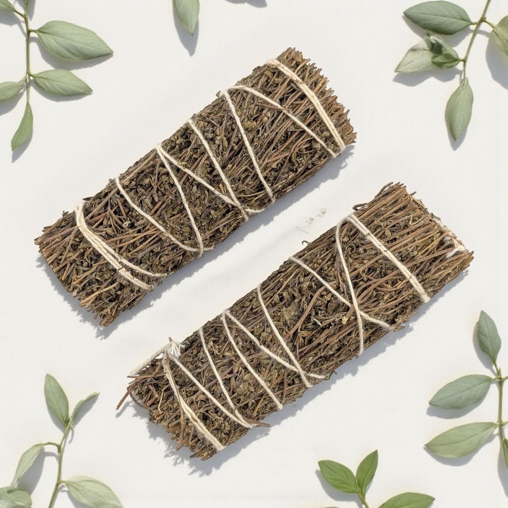 Two Pure thyme bundles tied with twine on a light background with green leaves. available in Barrie crystal store