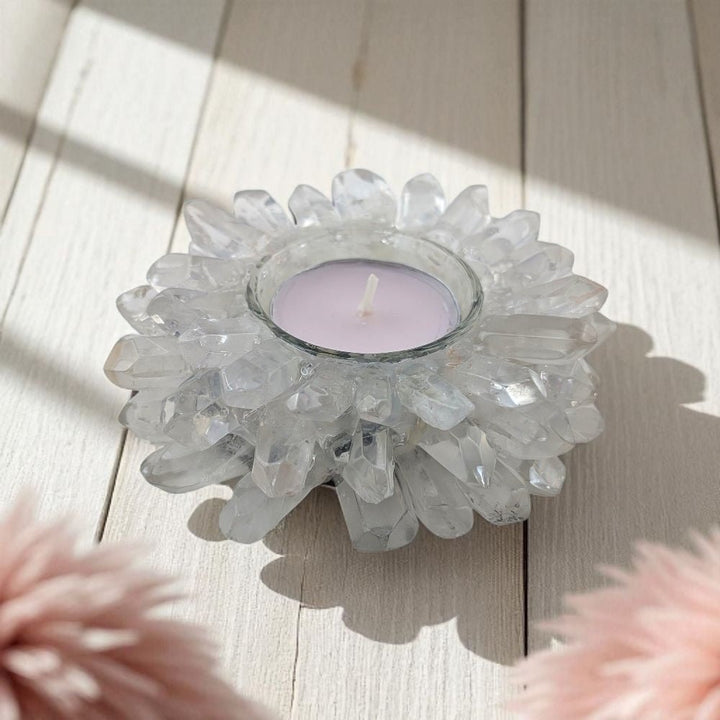 Decorative crystal candle holder with a candle on a wooden surface