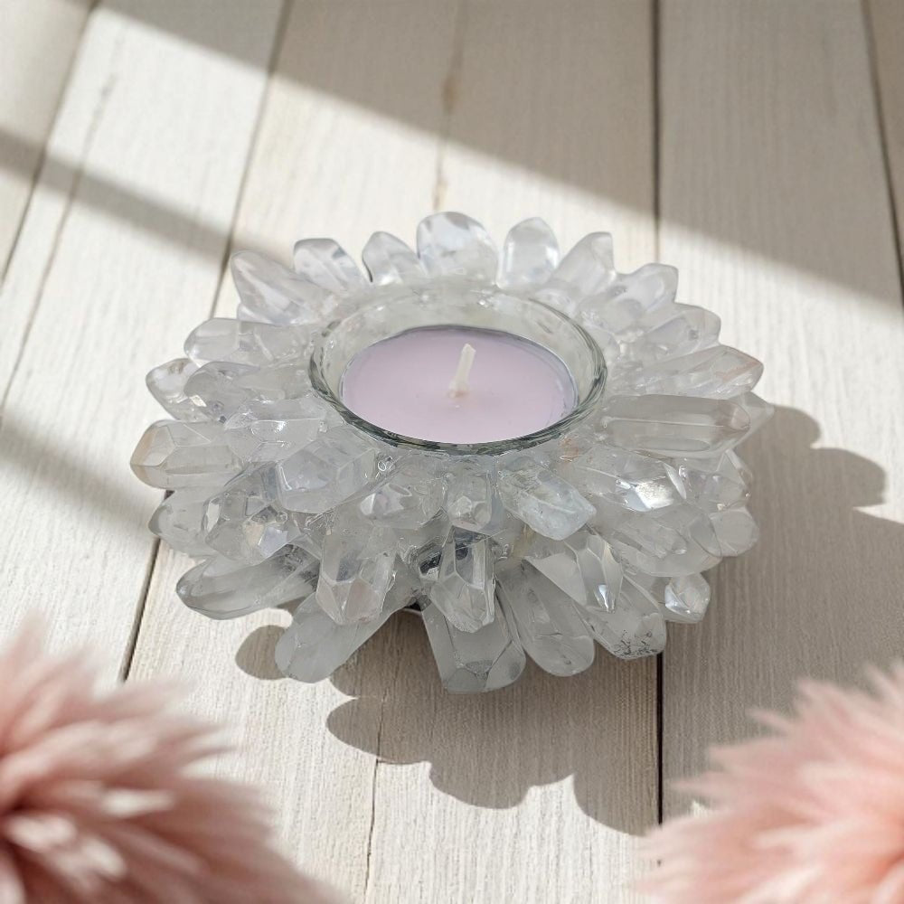 Decorative crystal candle holder with a candle on a wooden surface