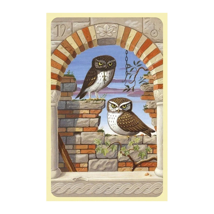 Card 12 from the Mystical Lenormand, showing two owls in a brick window