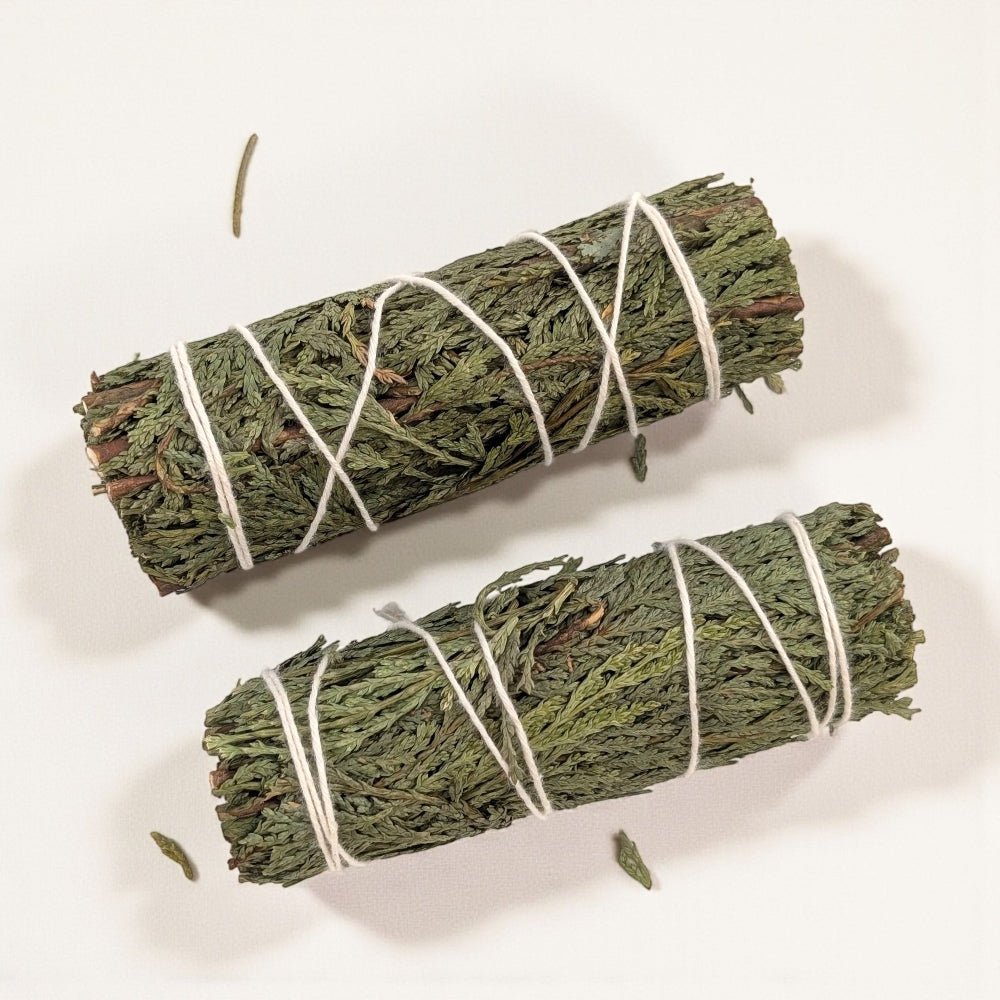 Two bundles of cedar tied with white string on a light background available at Barrie crystal store