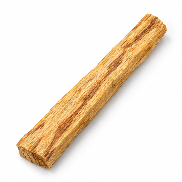 Loose unwrapped Palo Santo wood stick on a white background