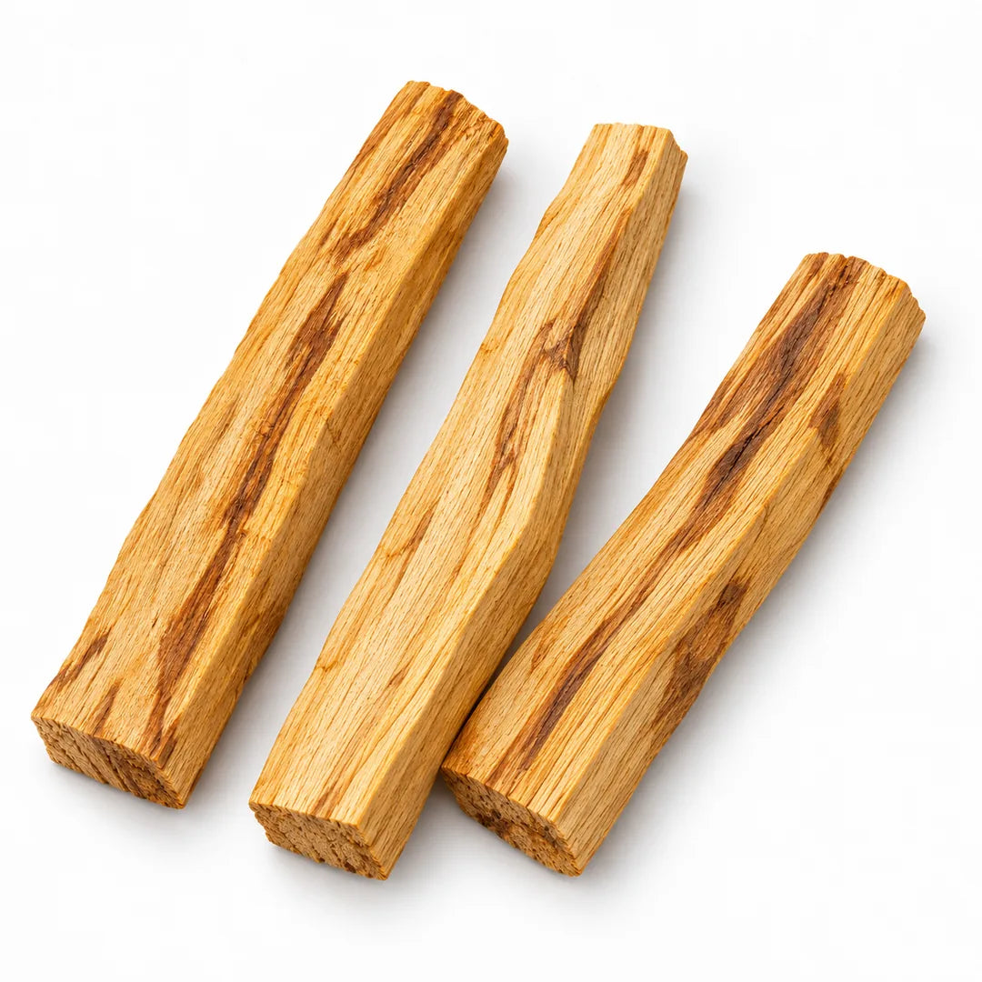 Three loose Palo Santo sticks arranged on white, showing natural variations in the wood; sold individually.