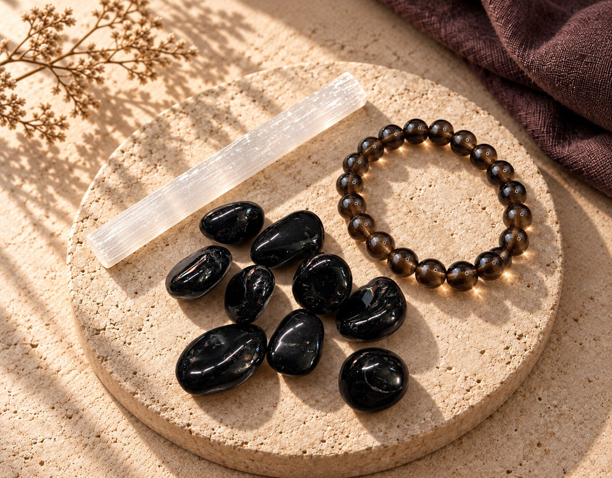Black Tourmaline, Selenite, and Smoky Quartz styled on warm limestone for Zen Collection’s Protect Your Energy collection.